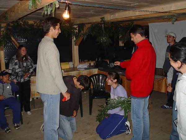 Campers acting out a sketch in the covered wooden pavilion