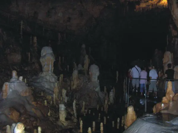 Visitors on the guided walkway among stalagmites in Bears' Cave